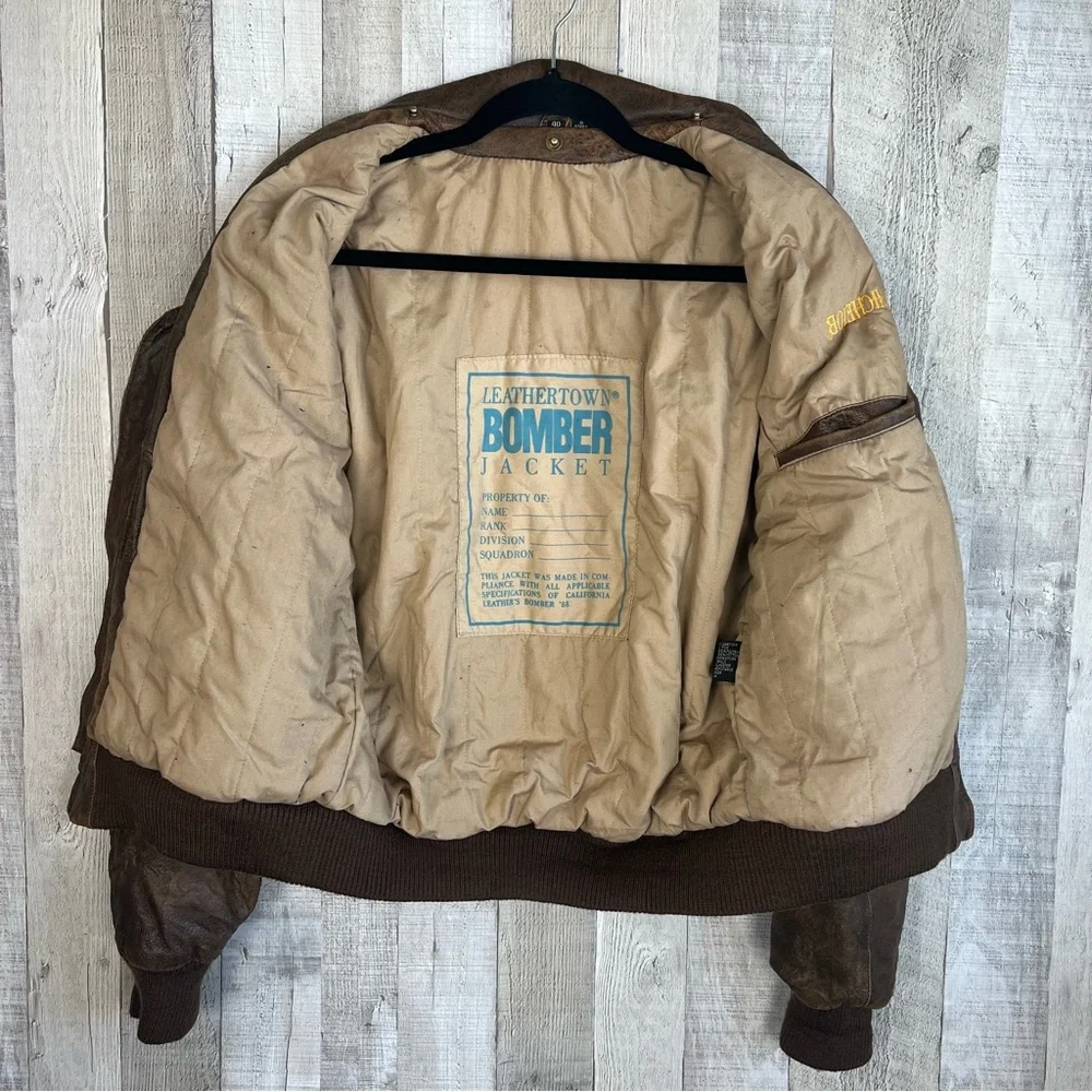 Vintage LeatherTown Bomber Aviator
Leather Jacket Size 40 Embroidered
Michelob - Picture 8 of 16